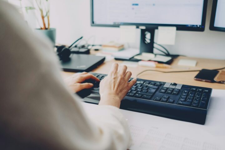Korean work culture - a person typing on a keyboard in an office